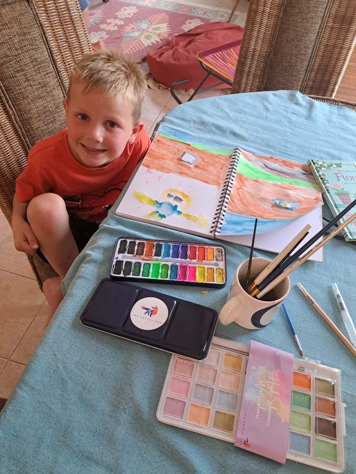 Young boy paints with The Artful Fox beginners paint set