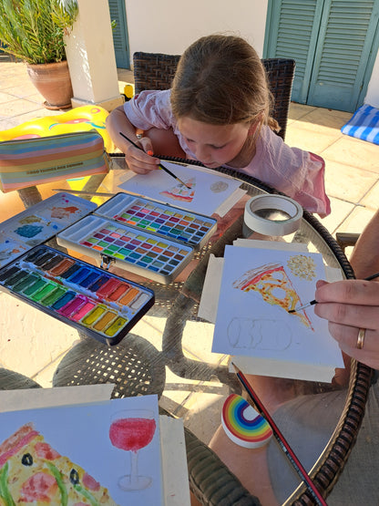 Children's and beginner's watercolour paint set by The Artful Fox. With 24 vibrant colours, in attractive tin with palette lid. Includes paintbrush! The perfect educational gift for the hobby artist in your life