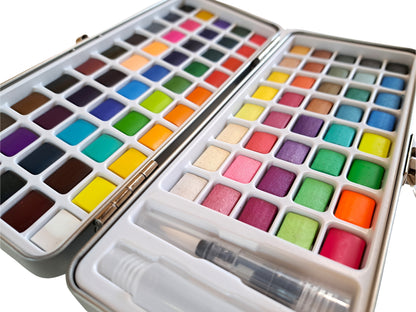 Watercolour paint set with 90 vibrant colours, in attractive travel tin. Includes refillable watercolour paintbrush! Perfect Christmas crafting gift for art lovers and creative kids by The Artful Fox