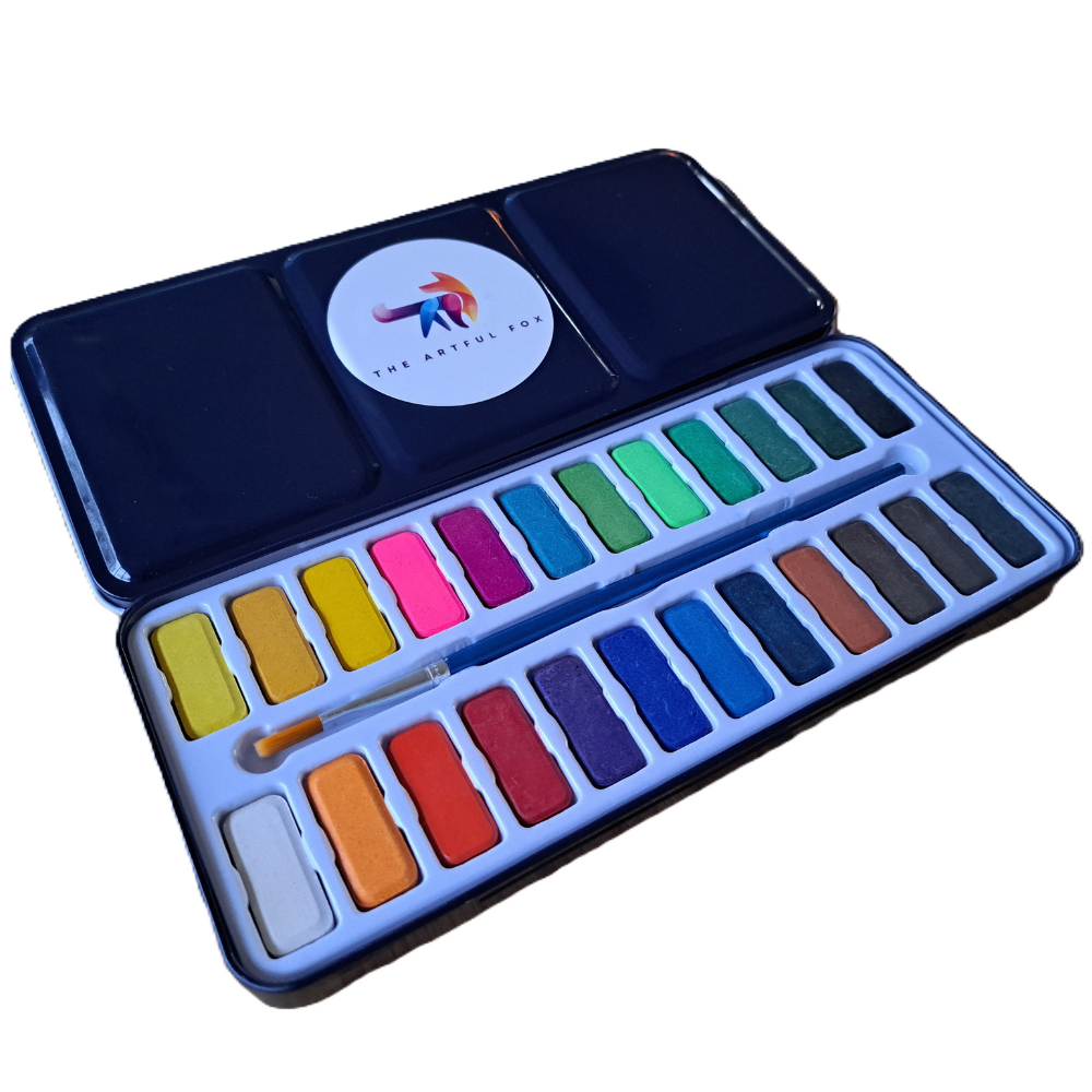 Children's and beginner's watercolour paint set by The Artful Fox. With 24 vibrant colours, in attractive tin with palette lid. Includes paintbrush! The perfect educational gift for the hobby artist in your life