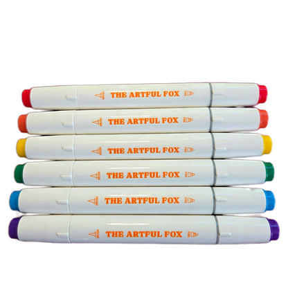 dual tip alcohol marker pens laid out showing bright colour range and brush and fine tips by The Artful Fox